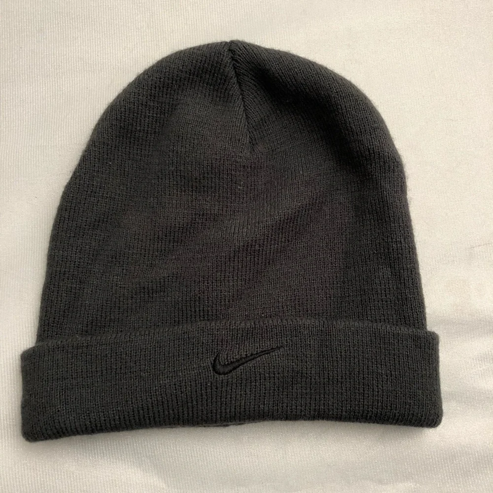 Nike dark gray beanie hat with black swoosh